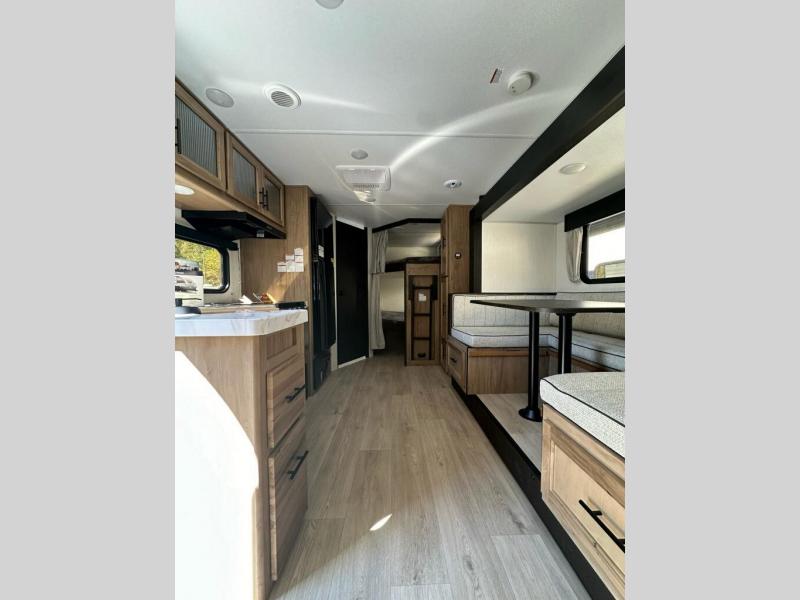 Forest River RV Cherokee Grey Wolf 23DBH with a slide out with a dinette and bunks and a kitchen